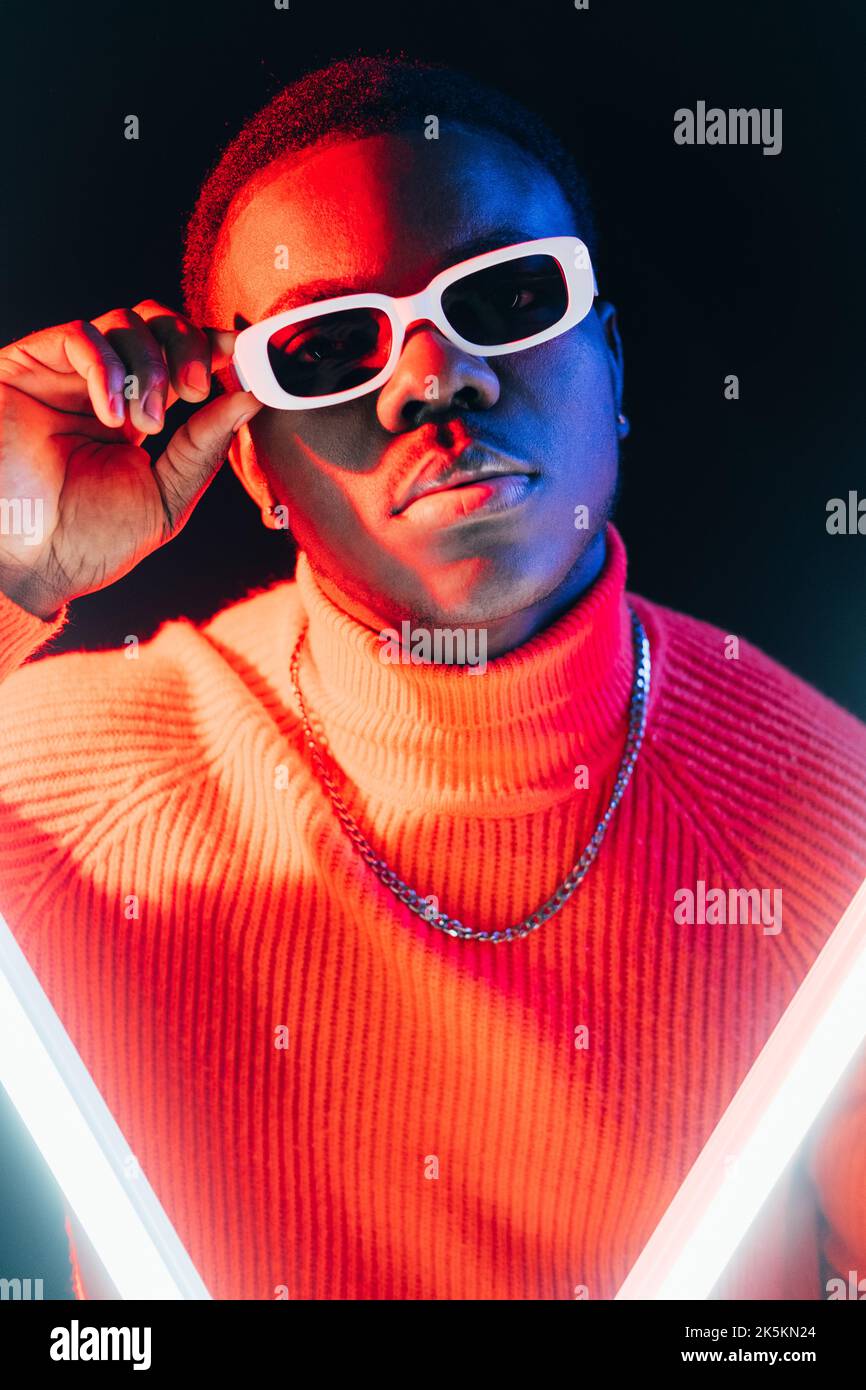 neon studio portrait eyewear fashion stylish man Stock Photo