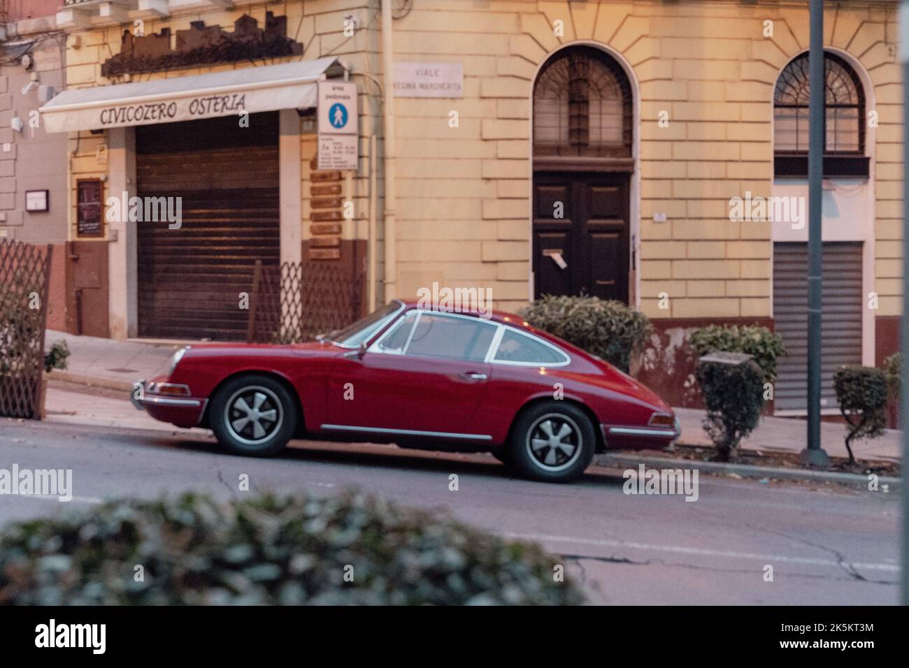 Vintage Red Car on the streets of Italy Stock Photo - Alamy