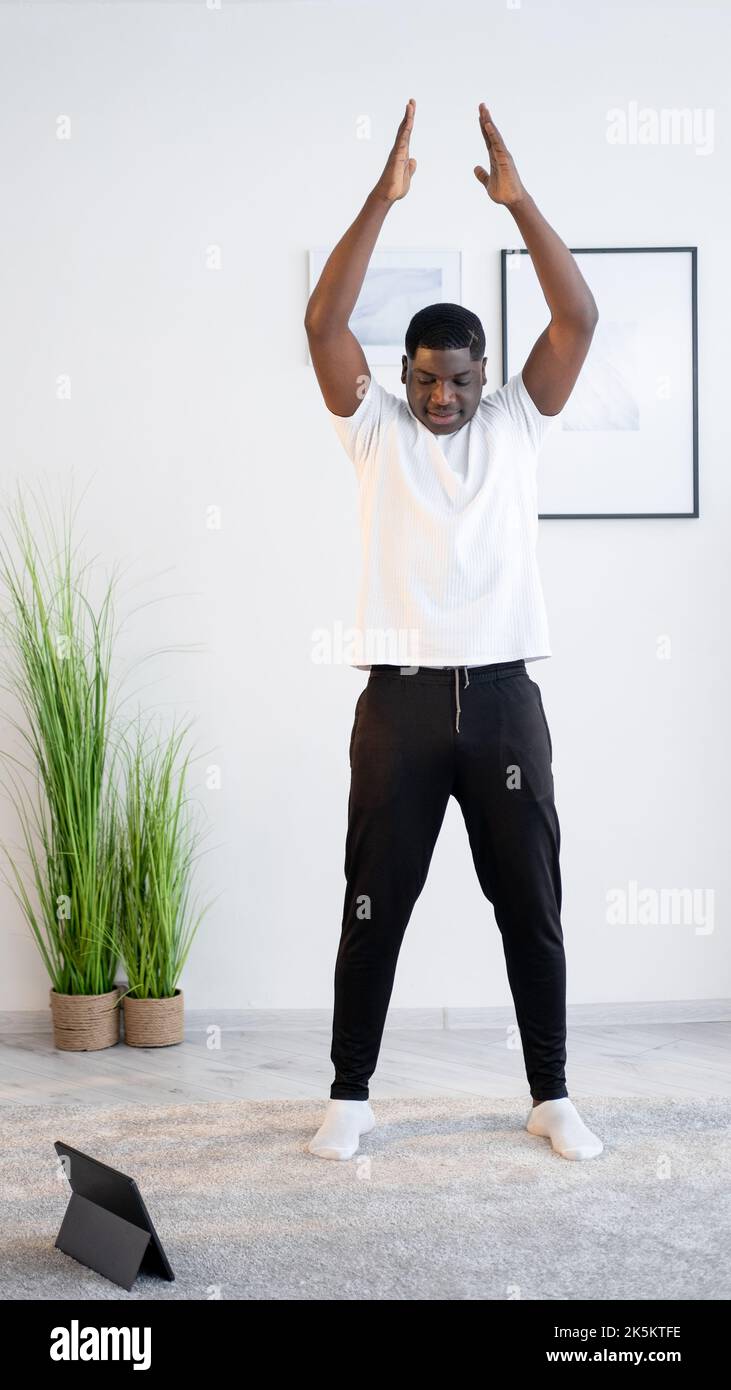 Happy black man white shirt hi-res stock photography and images - Alamy