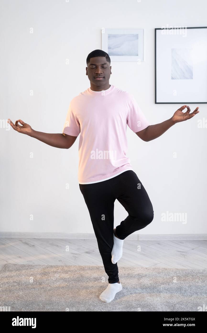 starting yoga practice black man home training Stock Photo Alamy