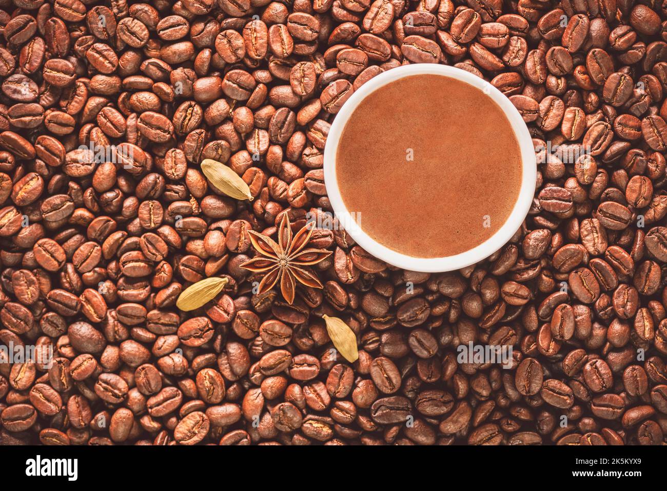Turkish coffee cup on roasted coffee beans. Top view with close up
