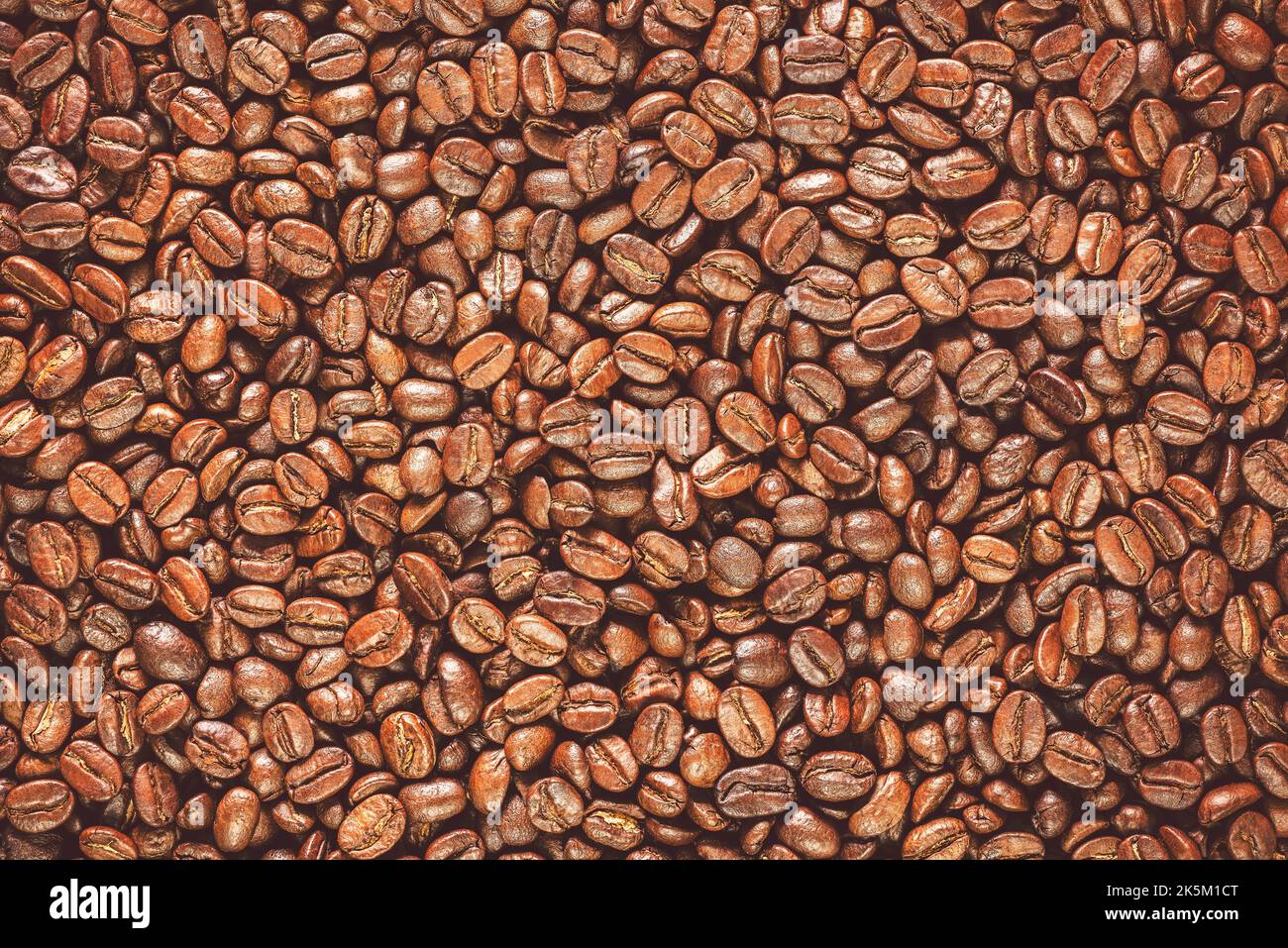 Roasted coffee beans background. Top view with copy space. Stock Photo