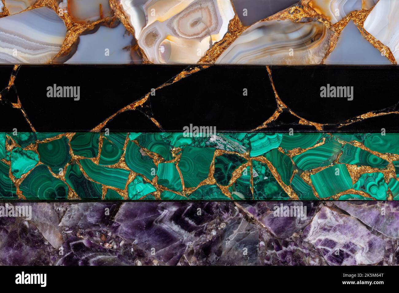 Black Obsidian, Amethyst, Malachite, Agate, variety of precious stones with a gold leaf for stylish interior. Material texture for unique interior Stock Photo