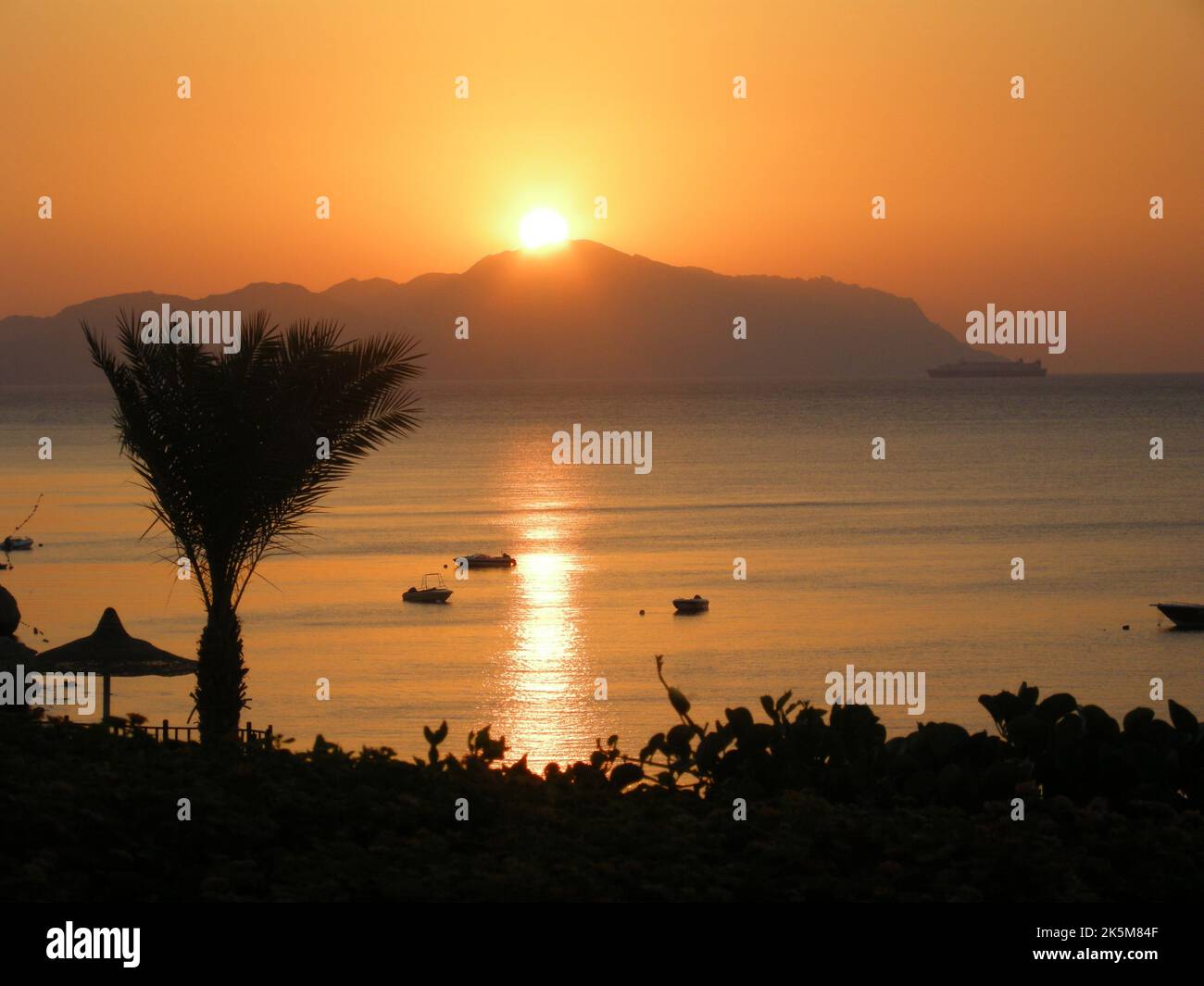 Lovely shot of the sunrise over Tiran Island in the red sea from sharm-el-sheikh Stock Photo