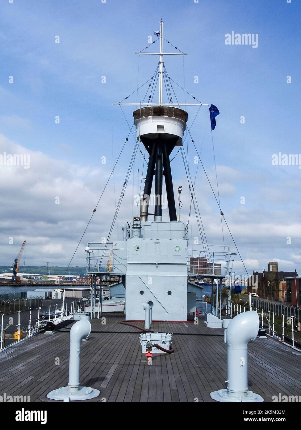 Crows nest lookout against a blue sky on an old Royal Navy warship. Stock Photo