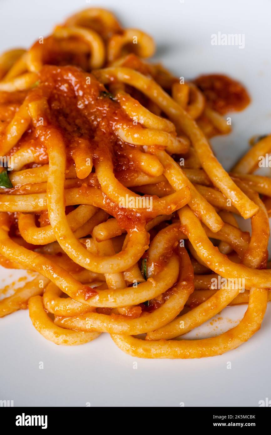 Pici all Aglione Traditional Thick Hand Rolled Garlic and Tomato Pasta from Siena, Tuscany, Italy Stock Photo