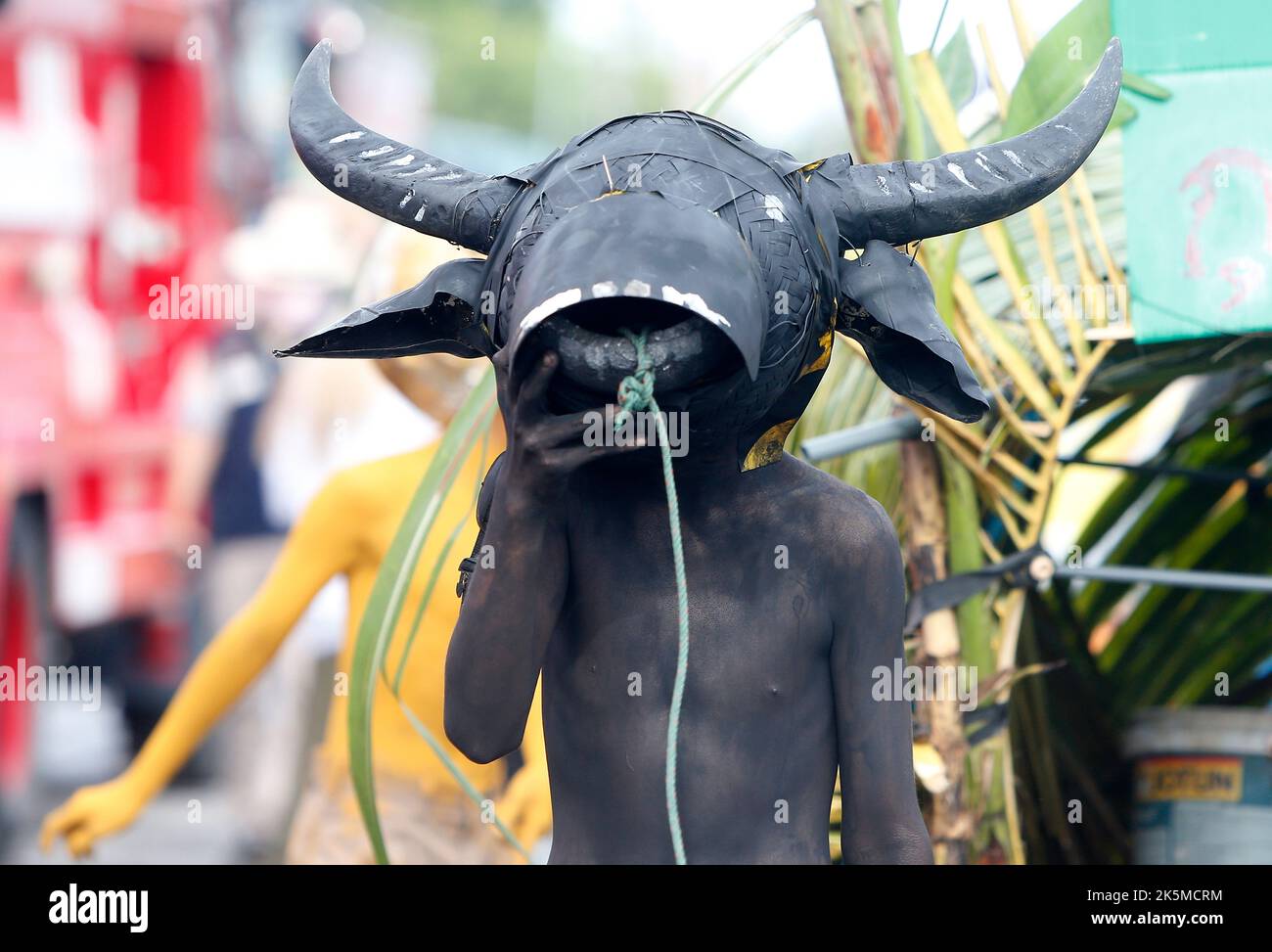 Chonburi, Thailand. 09th Oct, 2022. A boy wearing horned helmet and body paint arrives for Chonburi's annual buffalo race festival, east of Bangkok. The event, which also celebrates the rice harvest, dates back to the buffalo trade in Chonburi, once the commercial centre of Thailand's east. Credit: SOPA Images Limited/Alamy Live News Stock Photo