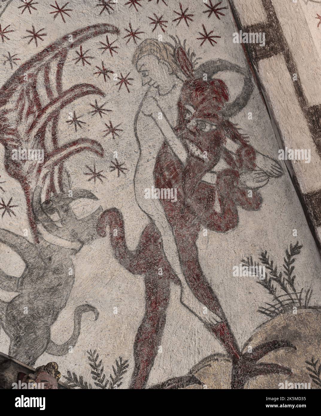 devil carying a man to the purgatory, an ancient fresco in Kirke Hyllinge church, Denmark, October 4, 2022 Stock Photo