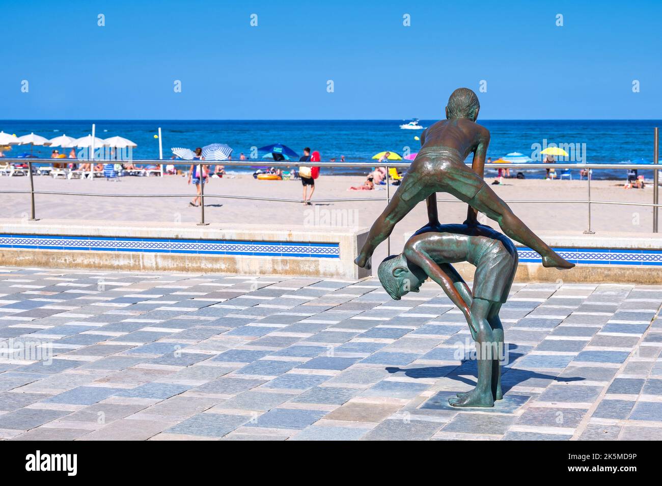 Sculpture of Carmen Fraile, Niños Jugando a Pílora, San Juan beach, Alicante, Spain. Stock Photo