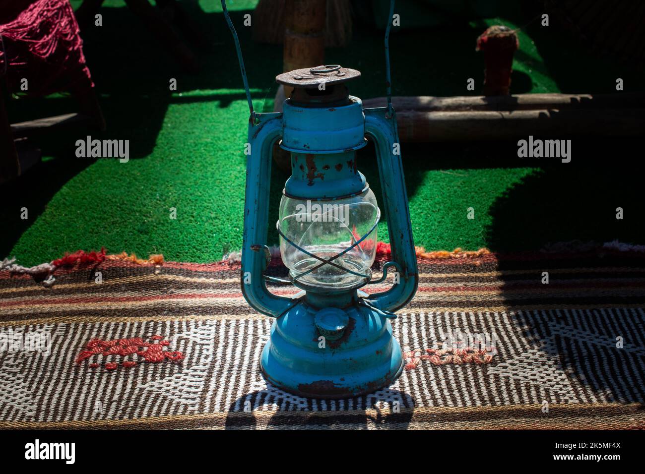 Old retro style lantern made of metal in hand Stock Photo - Alamy