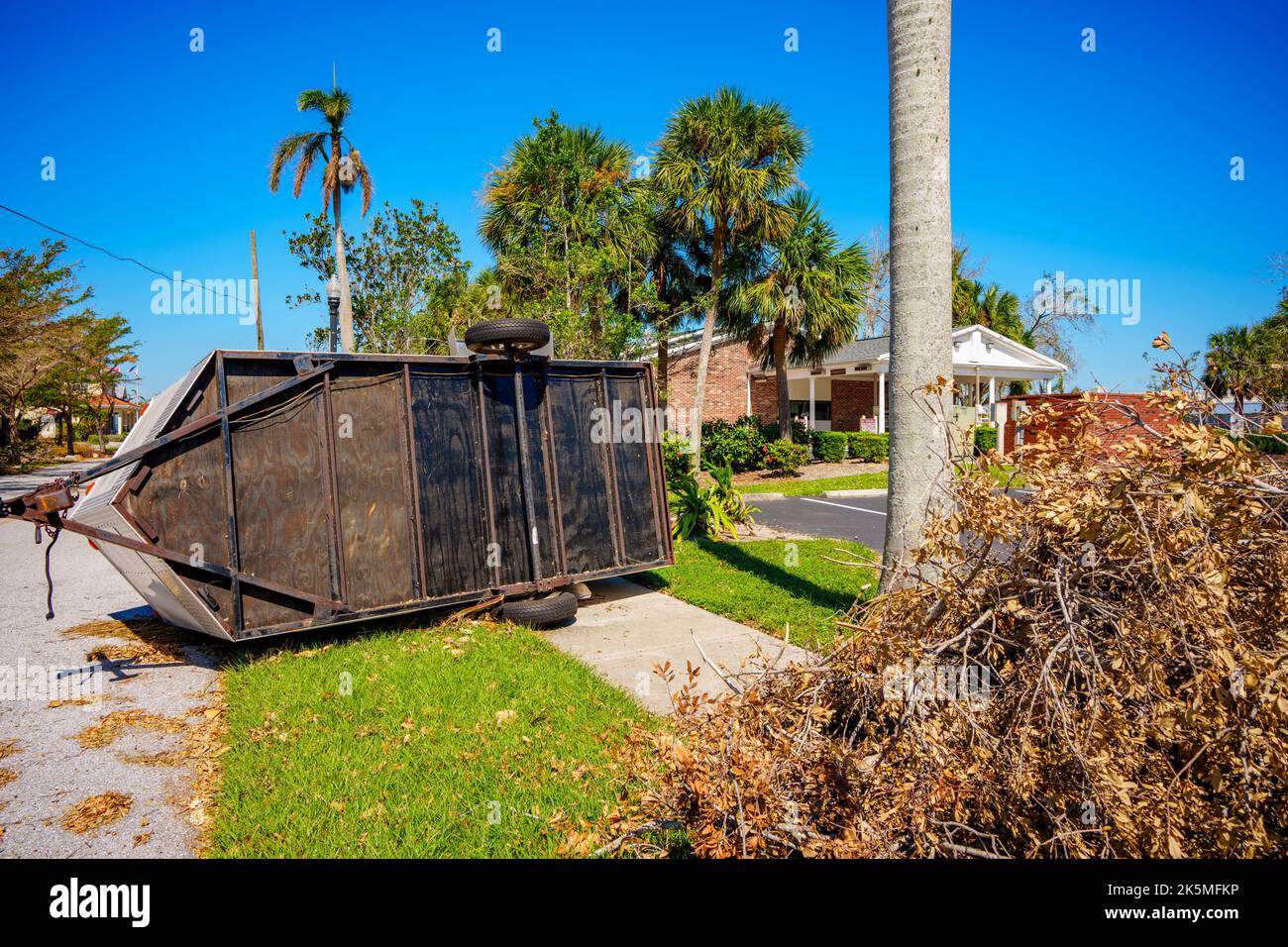 Trailer flipped on its side from heavy winds Hurricane Ian Stock Photo