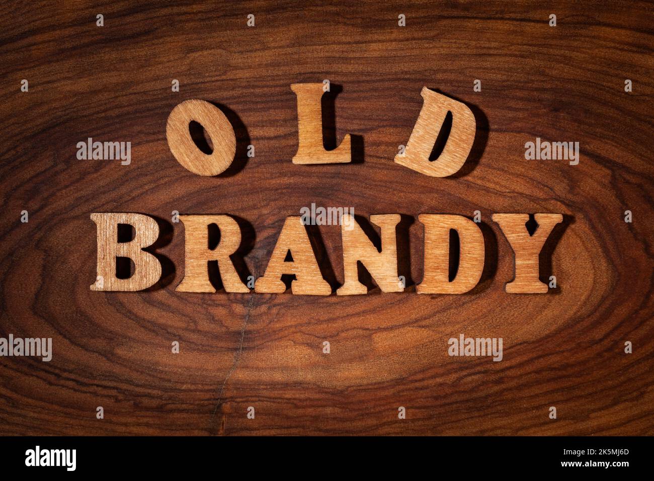 Old Brandy Text by wooden letters close up Stock Photo Alamy