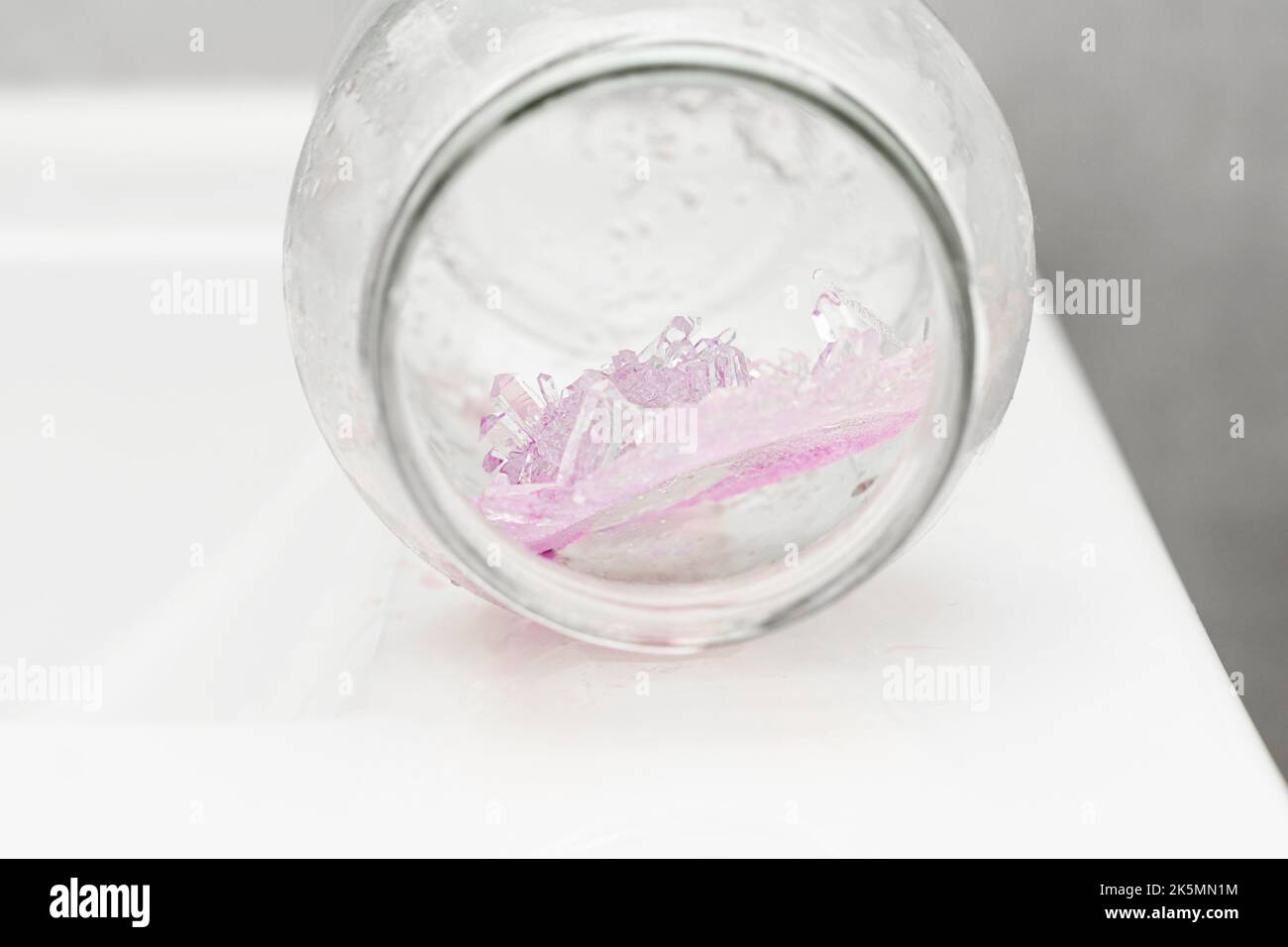 Chemical experiment on growing crystals. Crystal grown in a jar Stock