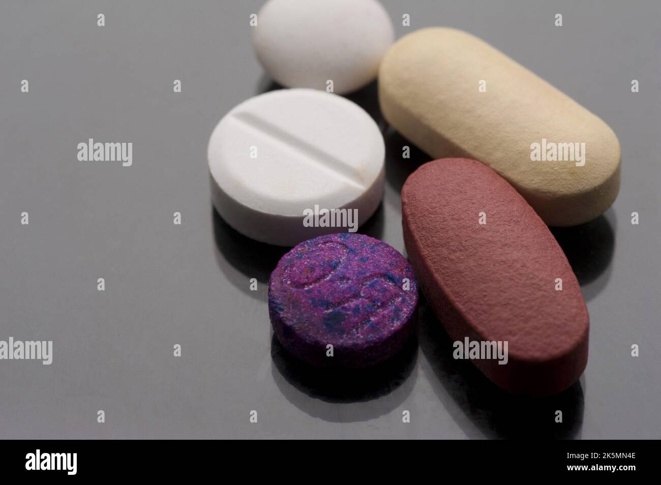 a pile of different shapes and colour tablets Stock Photo Alamy