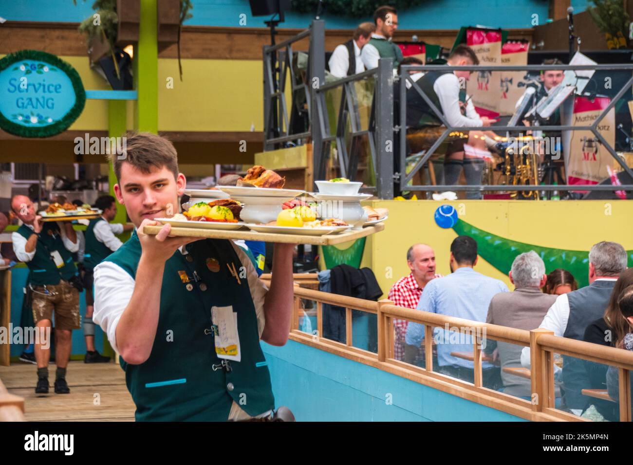 Food delivery in ochsenbraterei at the Octoberfest in Munich , Germany