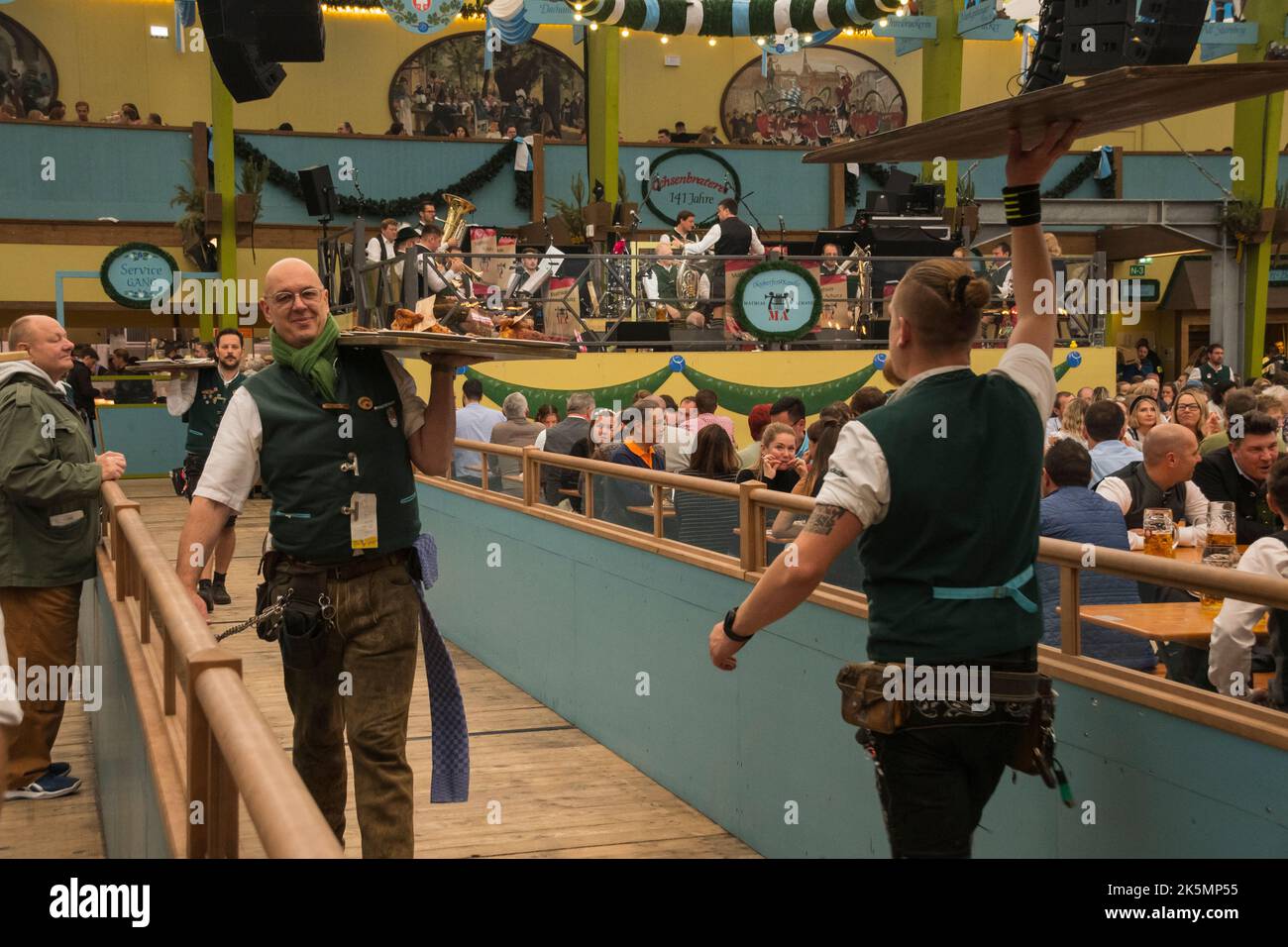 Food delivery in ochsenbraterei at the Octoberfest in Munich , Germany