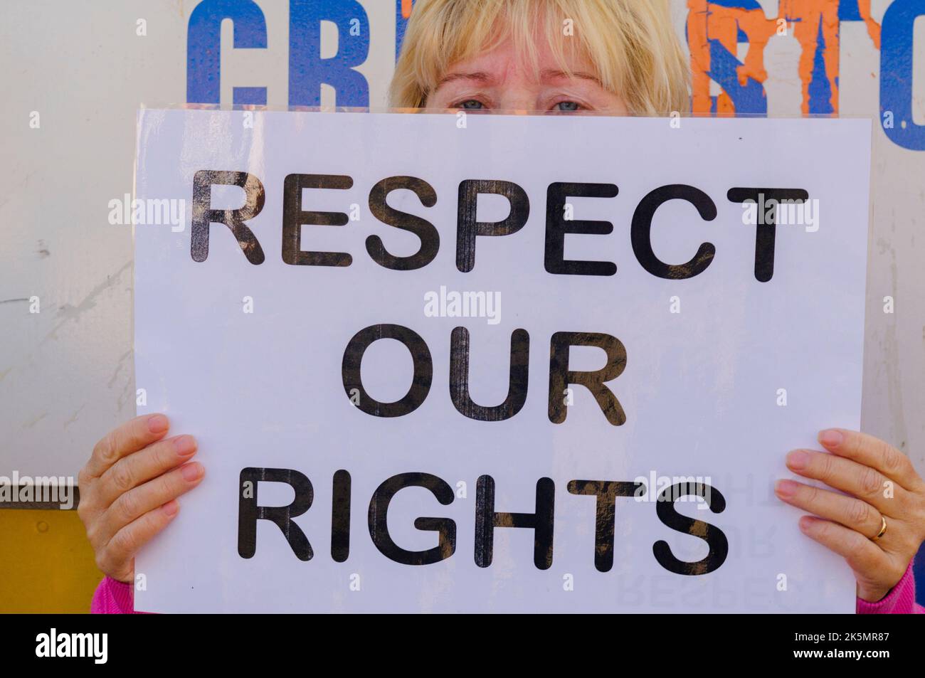 14/08/2010, Belfast, Northern Ireland.  A woman holds up a sign saying 'Respect our Rights' at a protest by Ardoyne residents against an Apprentice Boys of Derry parade. Stock Photo