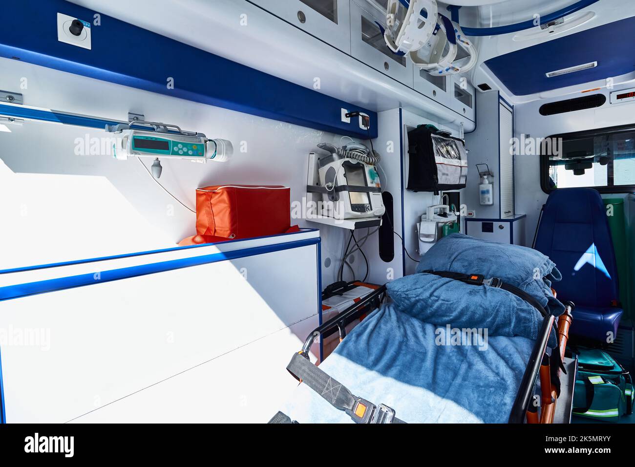 EMS. Interior of ambulance with gurney, defibrillator and other medical equipment and supplies