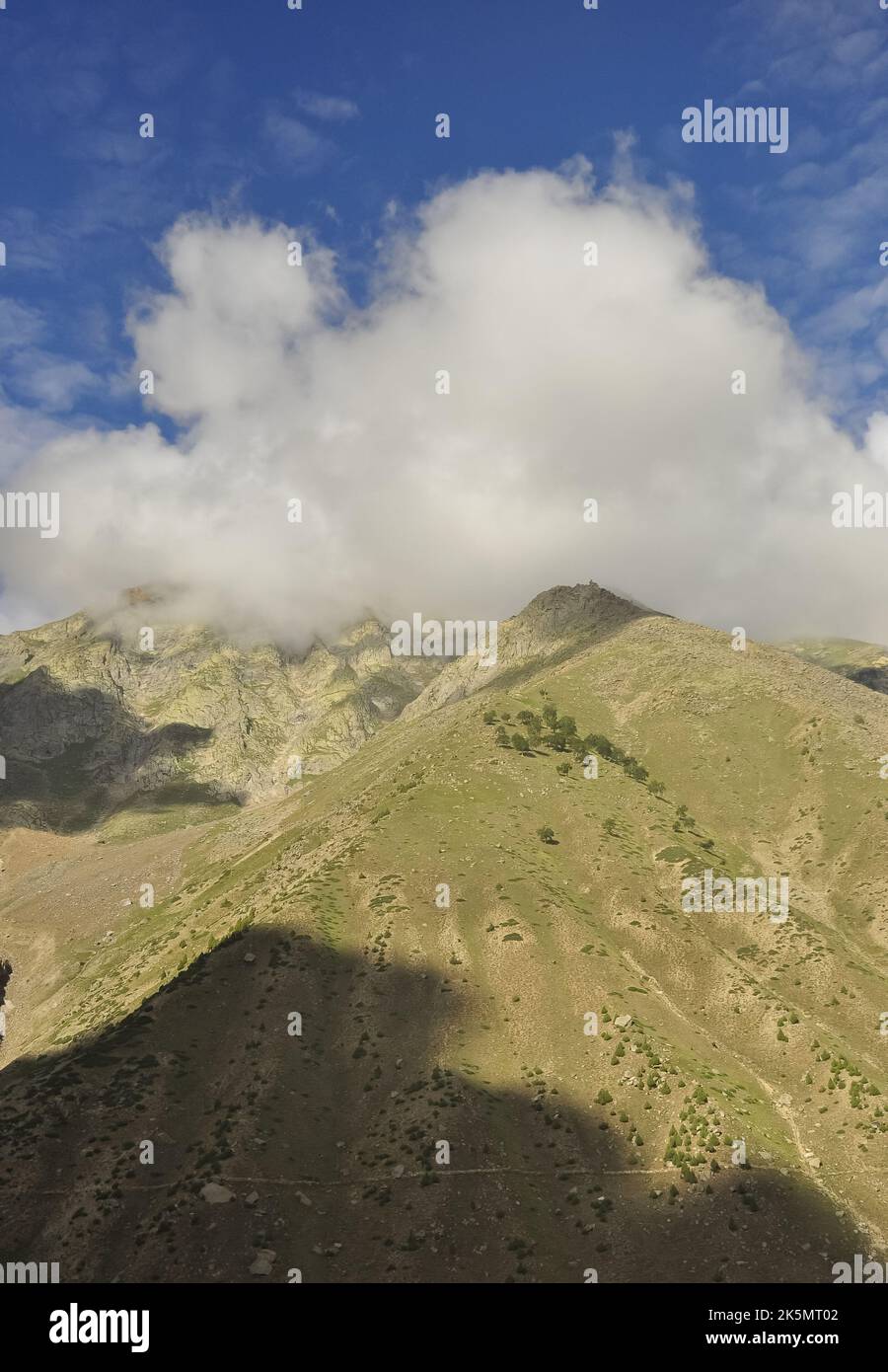 Morning view of dry mountain covered from the peak with clouds in Darcha, Lahaul and Spiti, Himachal Pradesh, India Stock Photo