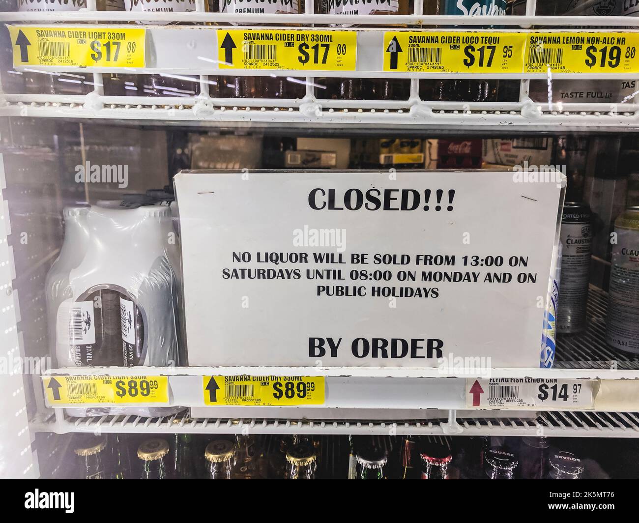 Sign in a beer fridge in a supermarket saying 'Closed!!! No liquor will be sold from 13:00 on Saturdays until 08:00 on Monday and on public holidays.  By order', Namibia Stock Photo