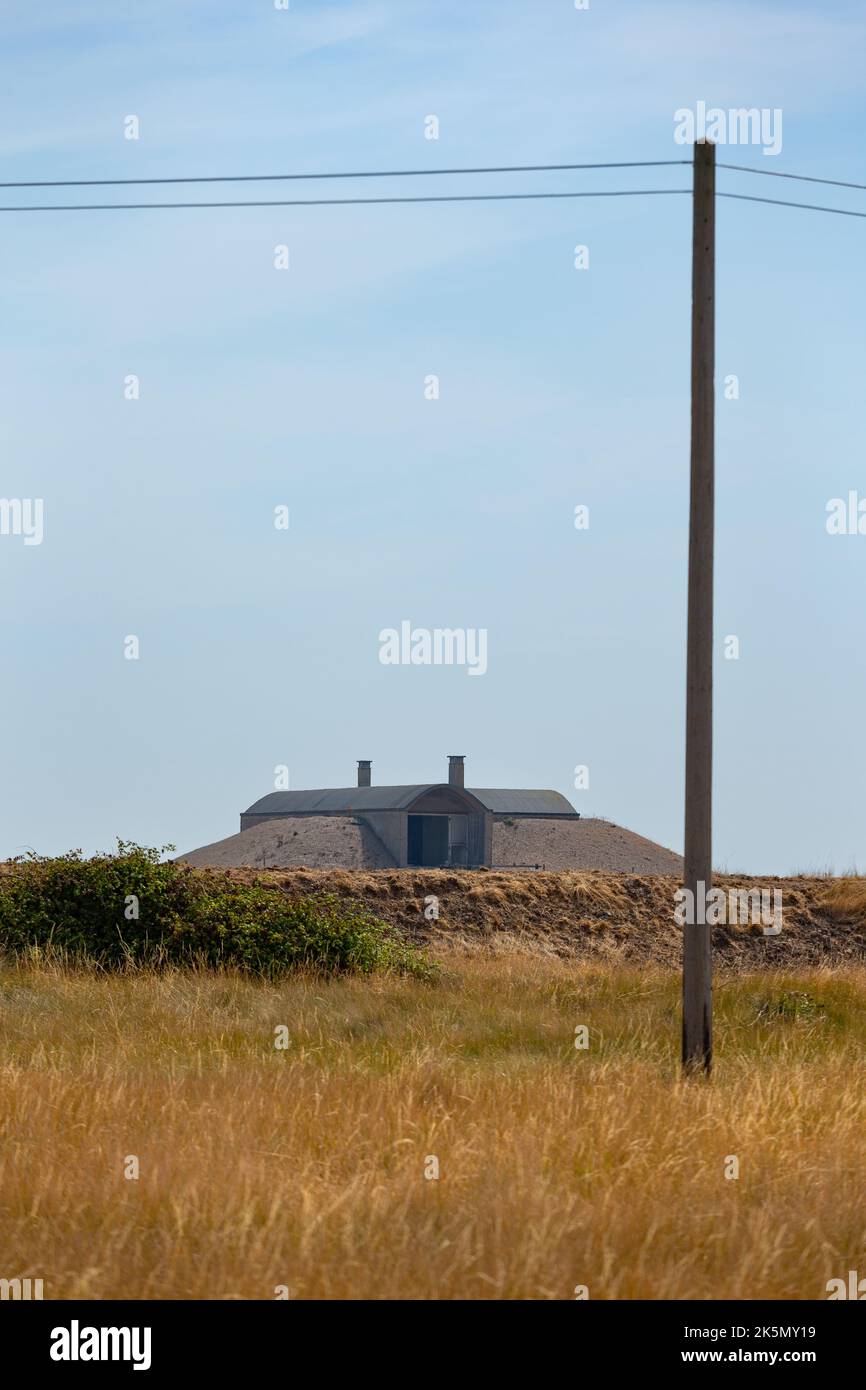Minimal landscape with telegraph pole, telephone lines and ballistic