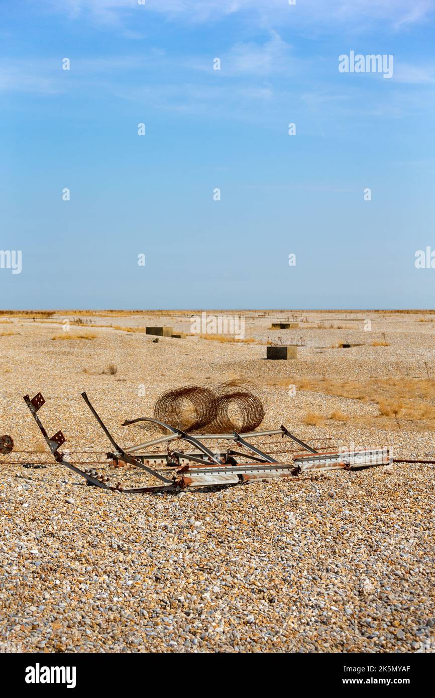 Flat shingle landscape with metal debris in foreground, Orford Ness, Suffolk, England Stock Photo