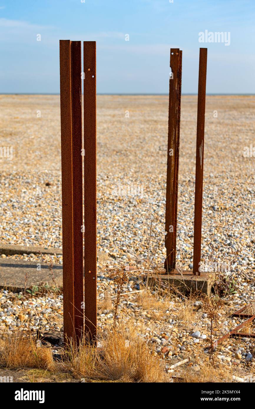 Rusted remnants of metal supports in a shingle landscape, Orford Ness, Suffolk, England Stock Photo