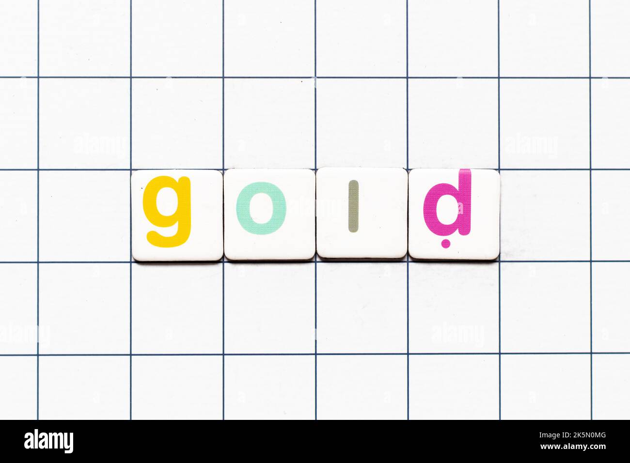 Colorful tile letter in word gold on white grid background Stock Photo