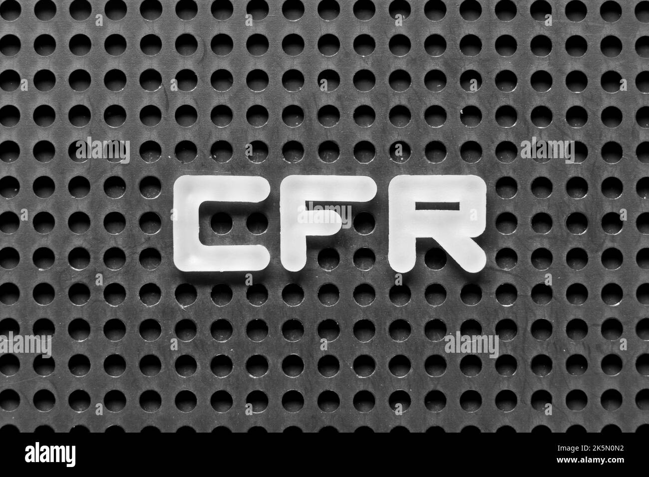 White alphabet letter in word CFR (abbreviation of Cost and freight) on