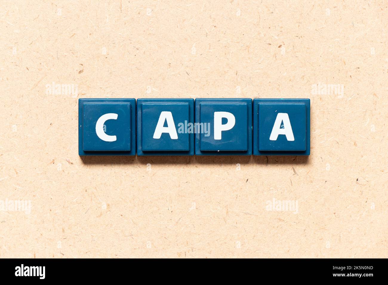 Tile letter in english word of CAPA (abbreviation of corrective action and preventive action) on wood background Stock Photo