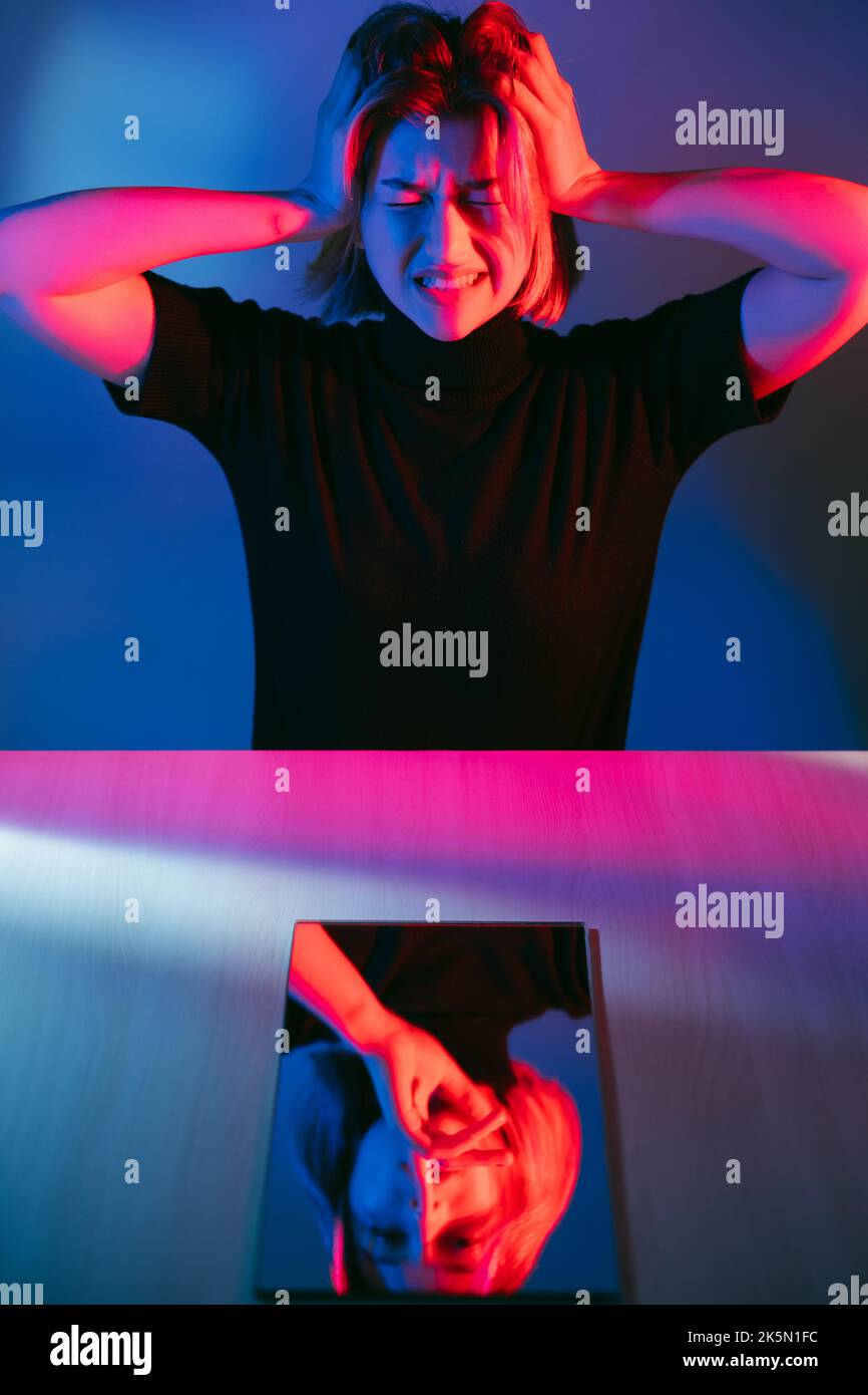Anxiety attack. Neon portrait. Mental disorder. Disturbed woman
