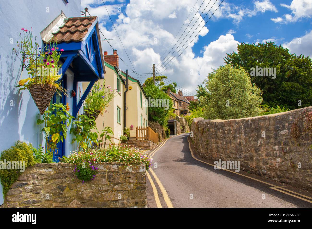 Street view with Pretty old houses of Cheddar a large village and