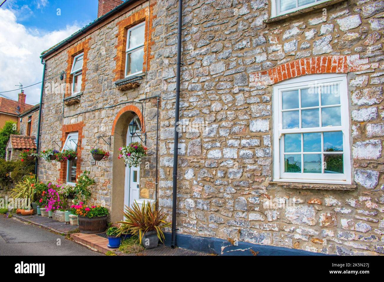 Street view with Pretty old houses of Cheddar a large village and
