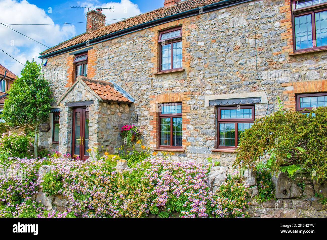 Street view with Pretty old houses of Cheddar a large village and