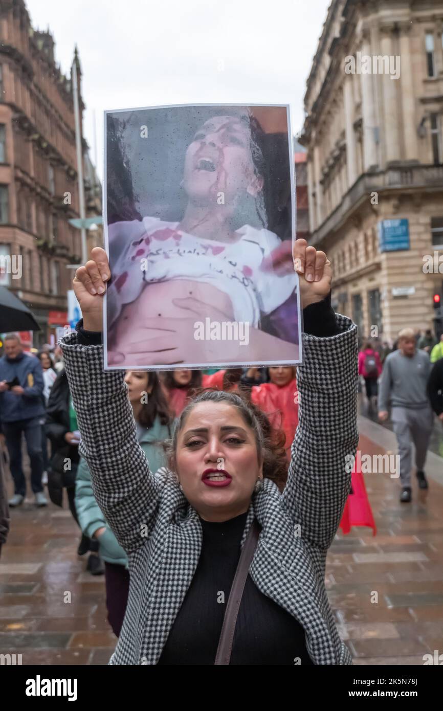 Glasgow, Scotland, UK. 9th October 2022: Campaigners march through the streets and gather in George Square to protest against human rights violations by the regime in Iran. Protestors wanted to show their support for Mahsa Amini, who was detained by the Morality Police and died after being arrested for wrongly wearing the hijab. Credit: Skully/Alamy Live News Stock Photo