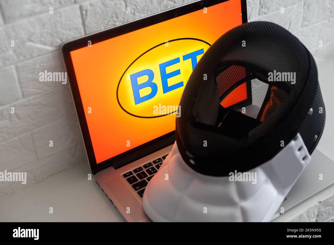 Bookmaker, fencing, sports betting on a laptop Stock Photo