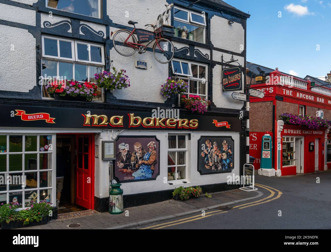 Carlingford, Ireland - 21 August, 2022: view of the historic and colorful house front of Ma Bakers Pub in the old town center of Carlingford Stock Photo