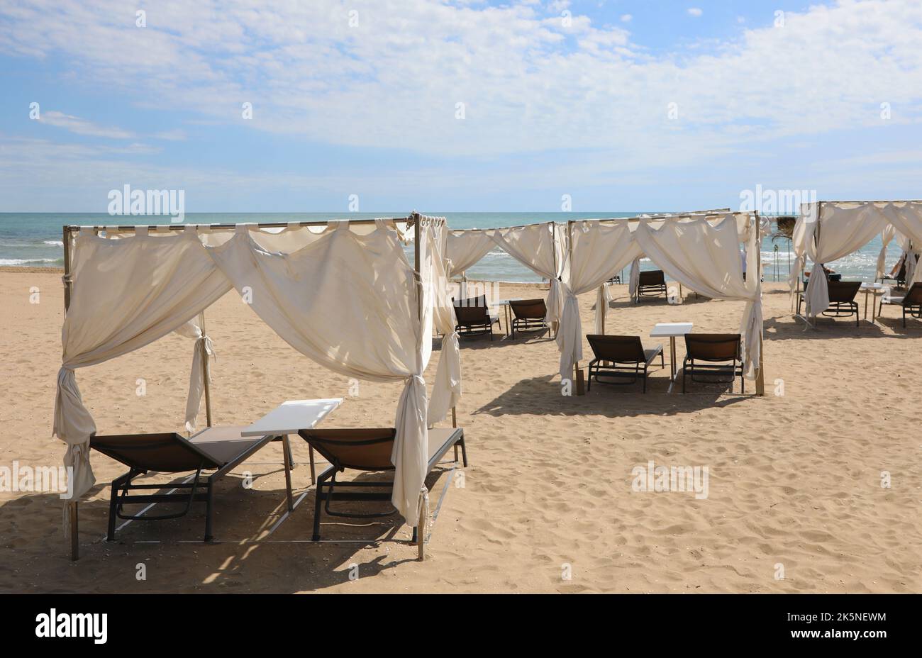 gazebo to shelter from the sun on the sunny beach in summer in an ...