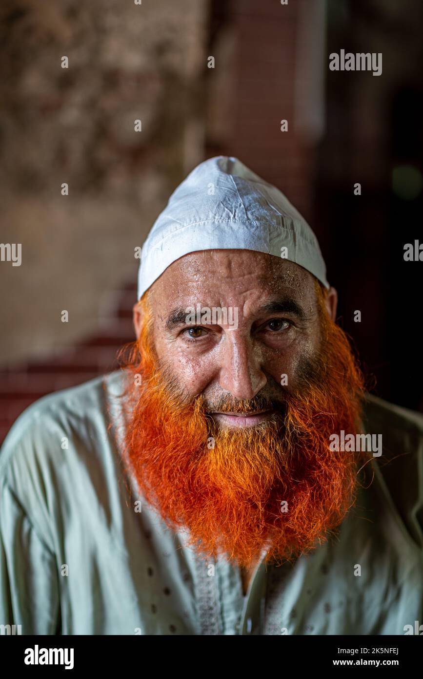Portrait of a muslim man with a beard dyed in henna, Lahore, Pakistan Stock Photo