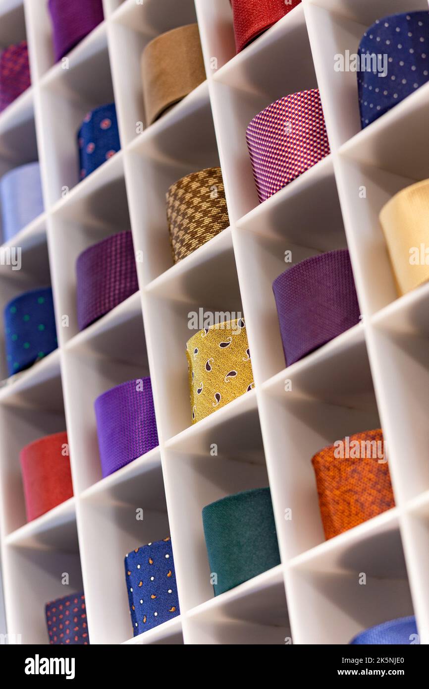 Showcase with multicolored ties. View of different colors ties in
