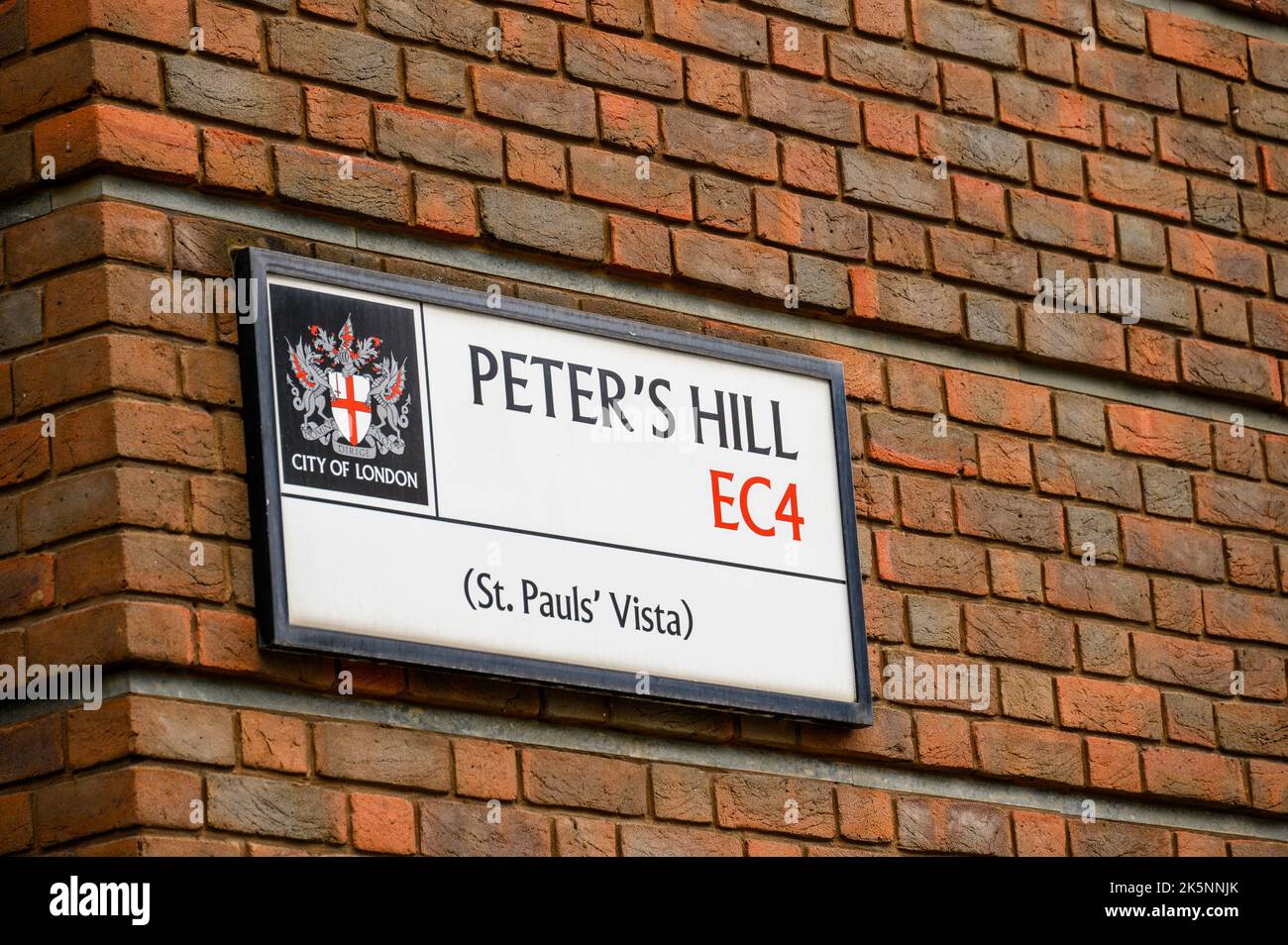 LONDON - May 21, 2022: Peter's Hill EC4 street sign on side of red brick building Stock Photo