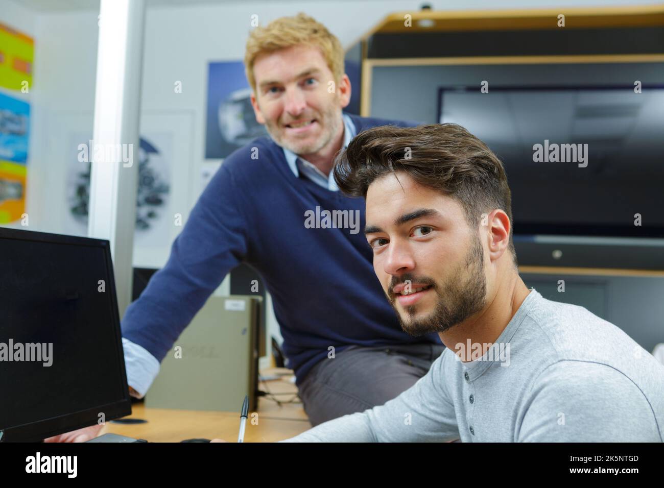 two screen appliance technicians posing Stock Photo