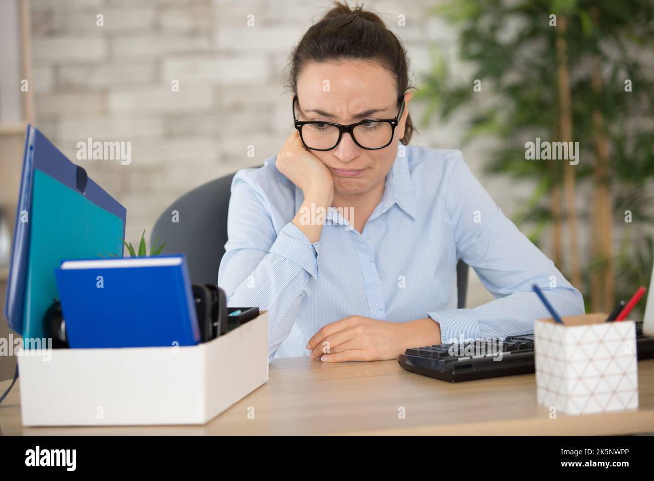 female employee being fired from her work Stock Photo