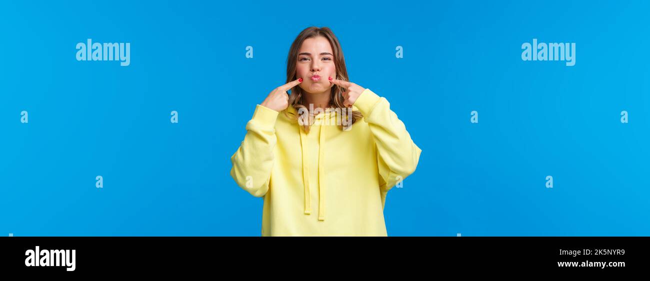 Women, lifestyle and emotions concept. Portrait of silly carefree girl ...