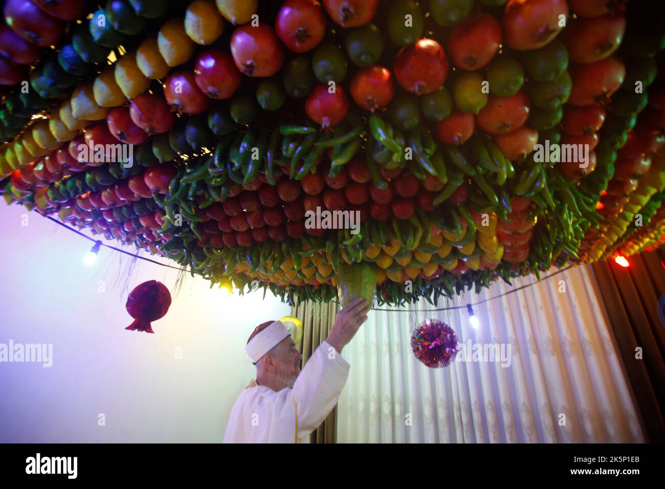 A member of the samaritan community decorates the traditional ritual