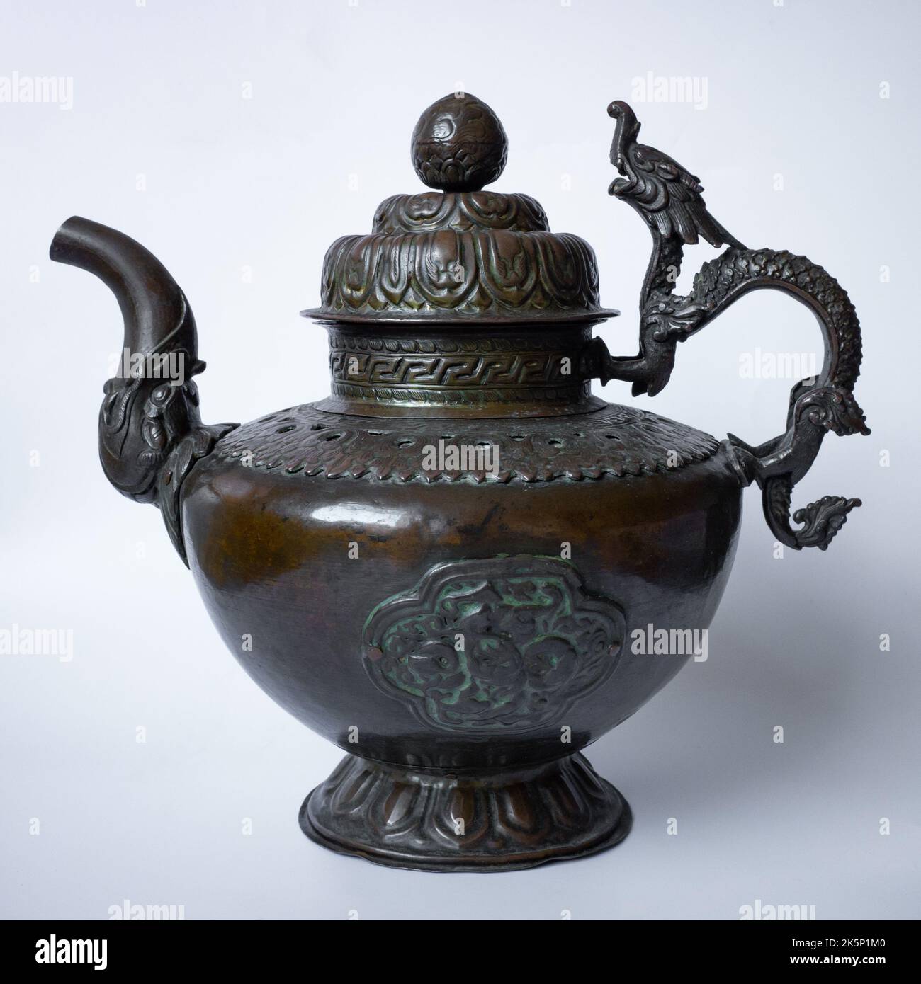 Antique Tibetan Buddhist Copper Teapot / Wine Pot With Dragon Handle. 19th century Stock Photo