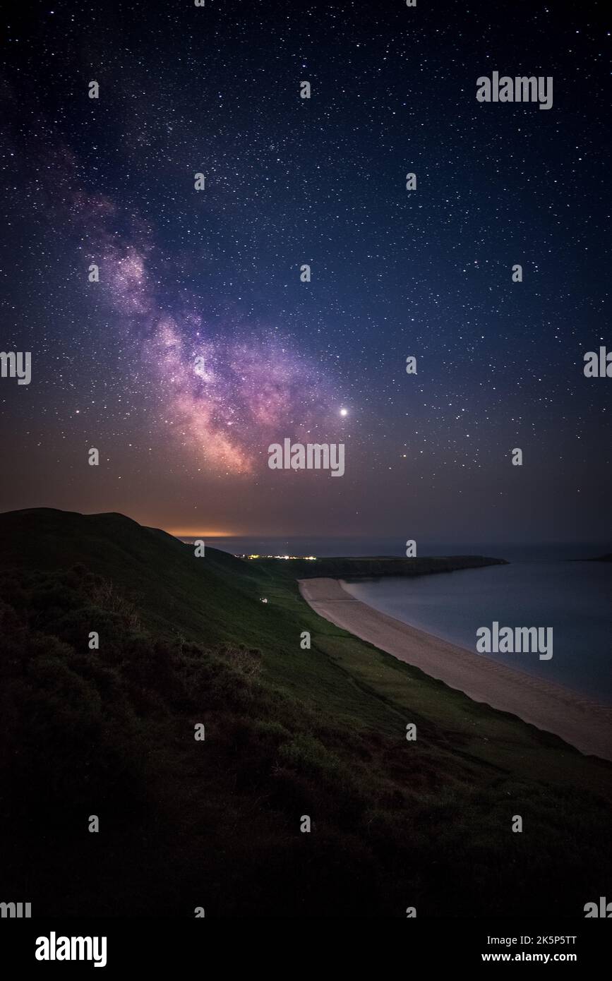 A vertical shot of a landscape under the starry sky at night Stock ...