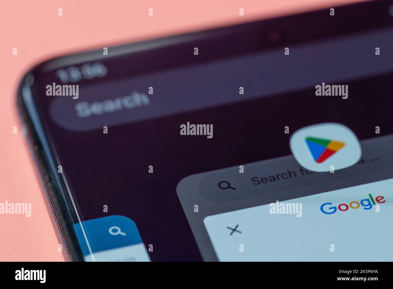 New york, USA - july 28, 2022: Search in google play store app in smartphone screen close up view Stock Photo