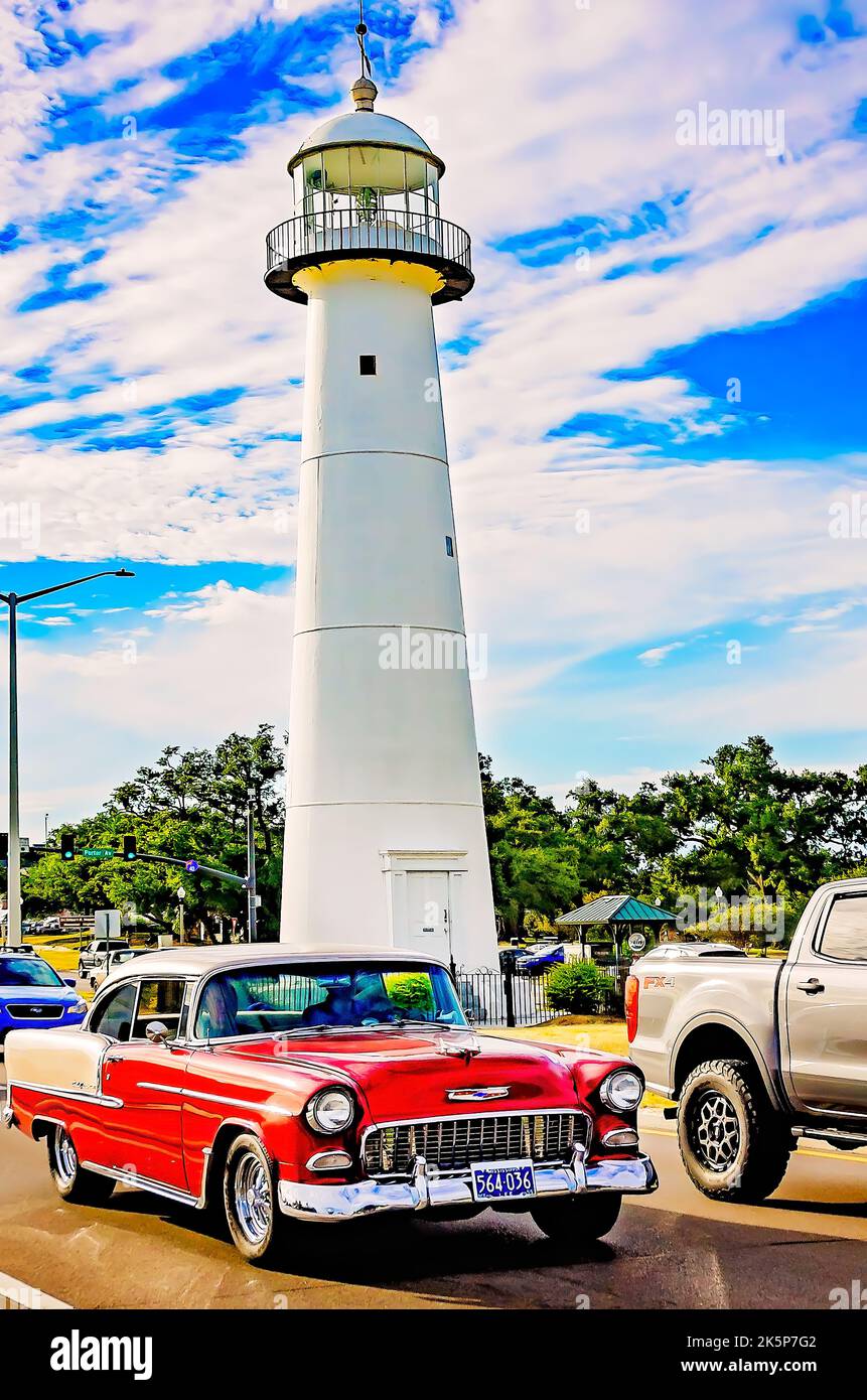A 1955 Chevrolet Bel Air passes Biloxi lighthouse during the 26th annual Cruisin’ the Coast