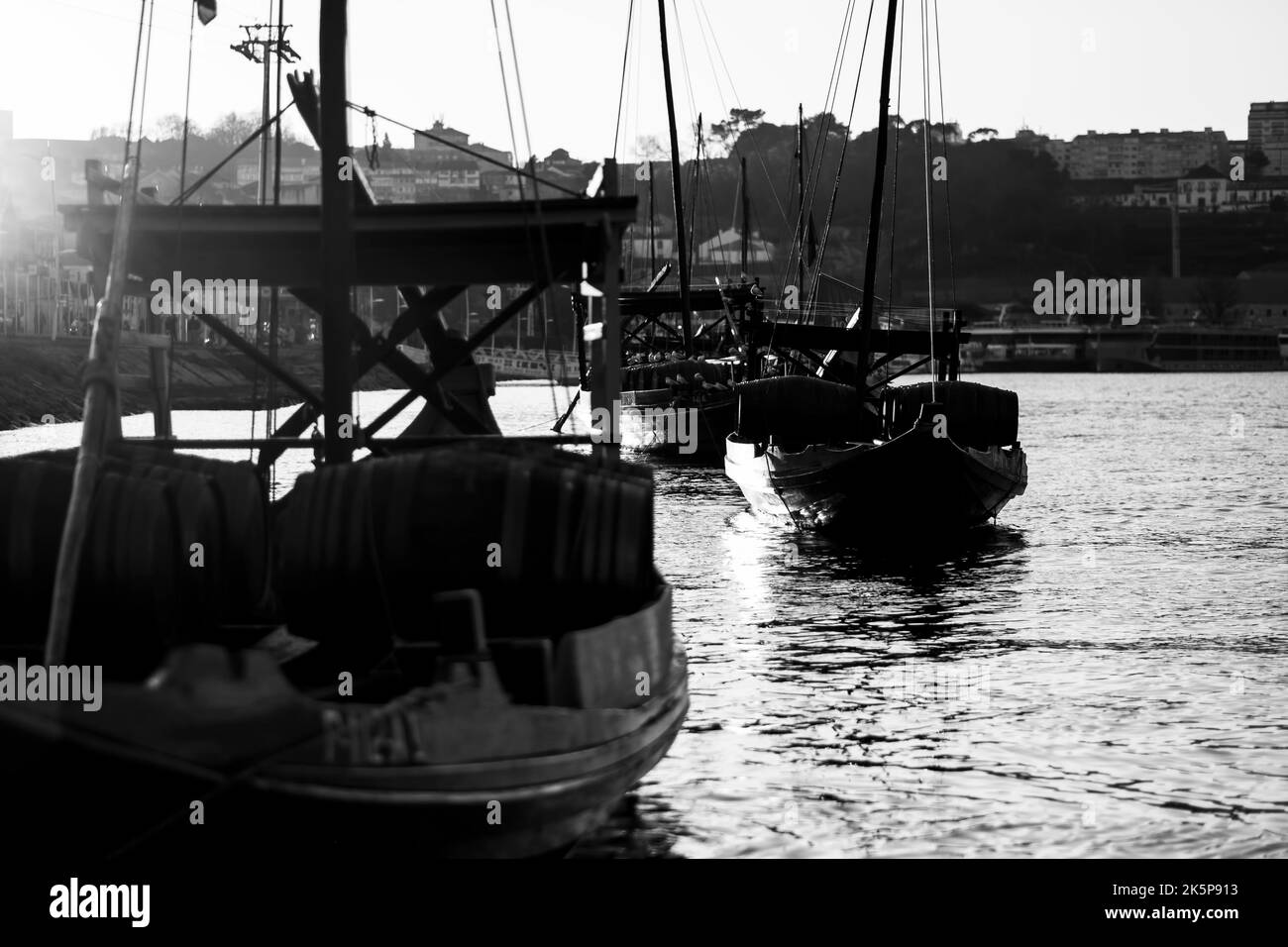 Vintage Traditional Boats in Vila Nova de Gaia, Porto, Portugal. Black and white photo. Stock Photo